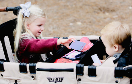 two blonde kids celebrating valentines day in mocha Keenz stroller wagon
